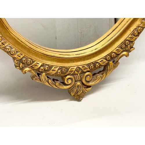 77 - A large ornate gilt framed mirror. 79x115cm