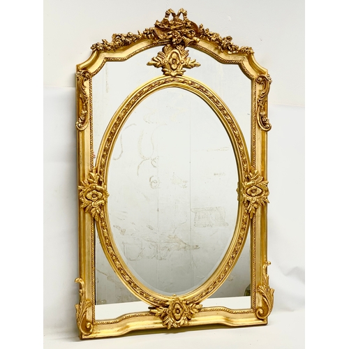 78 - A large ornate gilt framed mirror. 83x132cm