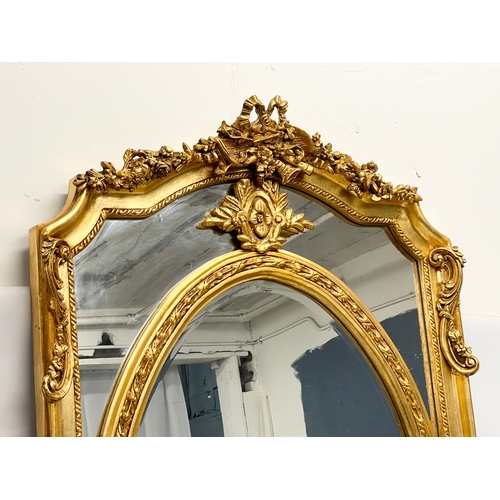 78 - A large ornate gilt framed mirror. 83x132cm