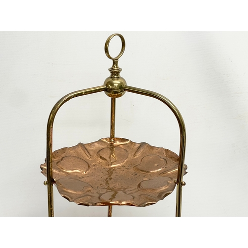 275 - A late 19th century Art Nouveau copper and brass 3 tier cake stand. 30x78cm