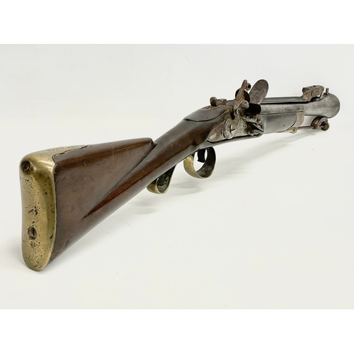 19 - An 18th century Blunderbust rifle with steel barrel and spring bayonet. Made in York for the Irish B... 