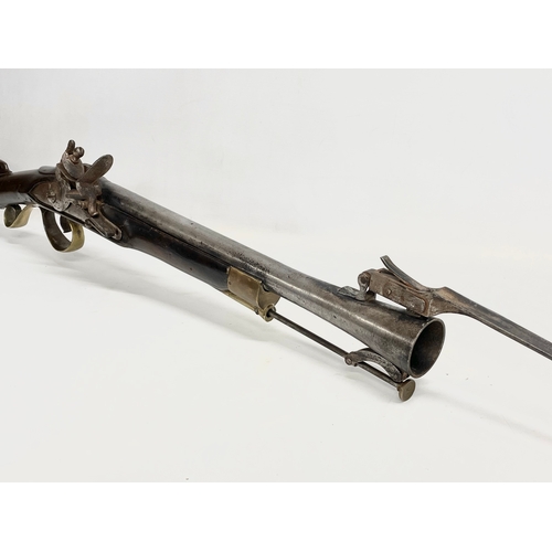 19 - An 18th century Blunderbust rifle with steel barrel and spring bayonet. Made in York for the Irish B... 