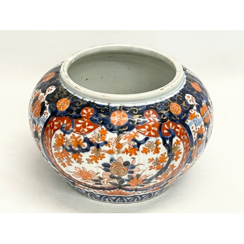 34 - A late 19th century Japanese Imari pattern jardiniere. Stamped. 25x17cm