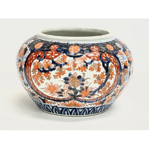 34 - A late 19th century Japanese Imari pattern jardiniere. Stamped. 25x17cm