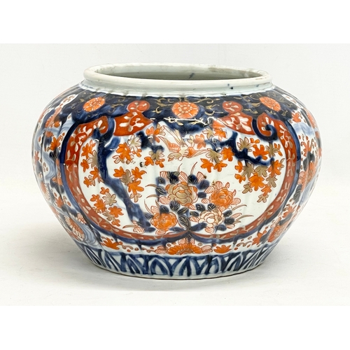 34 - A late 19th century Japanese Imari pattern jardiniere. Stamped. 25x17cm