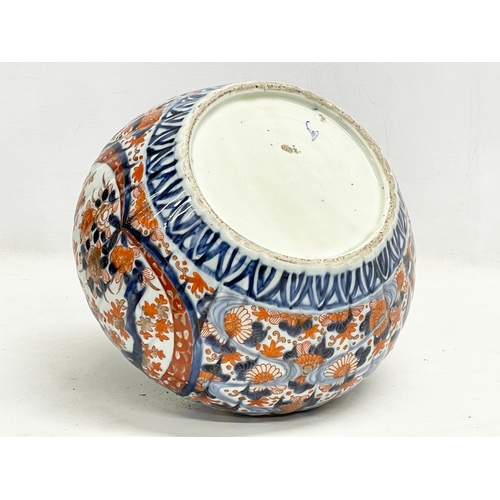 34 - A late 19th century Japanese Imari pattern jardiniere. Stamped. 25x17cm