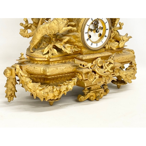 24 - A large Phillipe. H. Mourey (1840-1910) late 19th century gilt spelter mantle clock. With pendulum. ... 