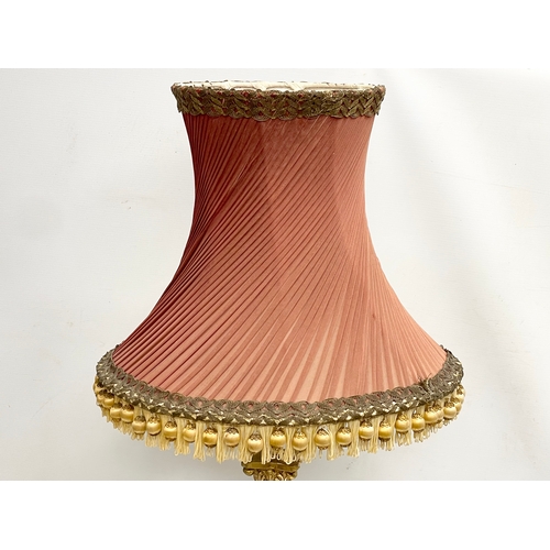 79 - A tall good quality gilt brass table lamp with Corinthian style pillar. Base measures 18x63cm.