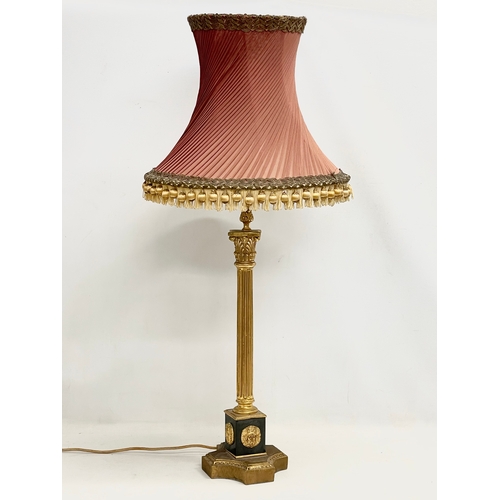 79 - A tall good quality gilt brass table lamp with Corinthian style pillar. Base measures 18x63cm.