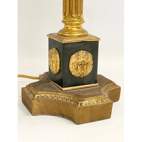 79 - A tall good quality gilt brass table lamp with Corinthian style pillar. Base measures 18x63cm.