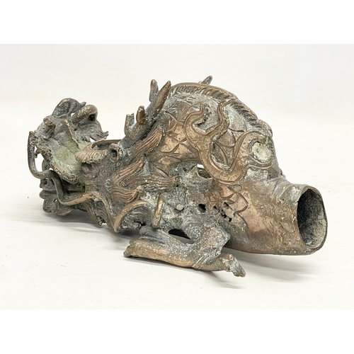 38 - A 19th century Chinese bronze incense burner. 21x10x11cm