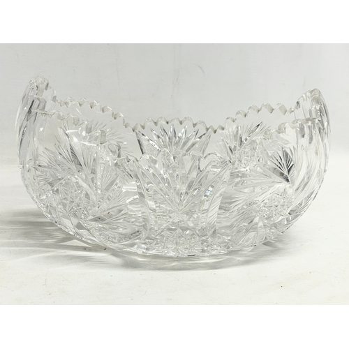 794 - A quantity of large heavy crystal bowls and vases.