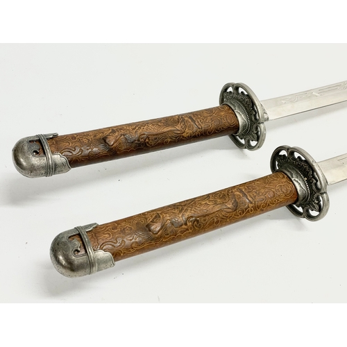 276 - A pair of good quality samurai style swords. 93cm