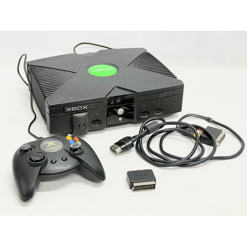 205 - An XBOX console with controller and leads.