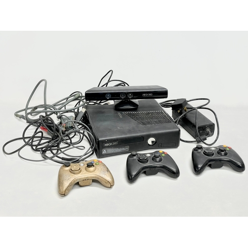 207 - An XBOX 360 console with a Kinect, 3 controllers and leads.