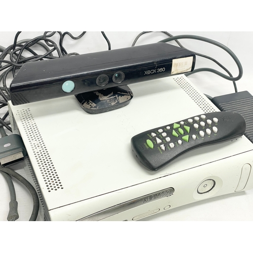 209 - An XBOX 360 console with 3 controllers, a Kinect, an XBOX remote and leads.