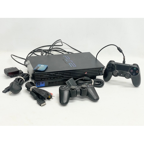 210 - A PlayStation 2 (PS2) with 2 controllers, memory card and leads.