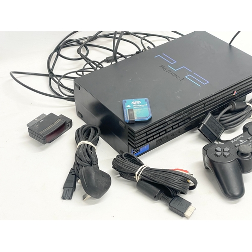 210 - A PlayStation 2 (PS2) with 2 controllers, memory card and leads.