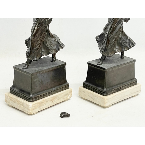 47 - A pair of 1920’s Art Deco spelter and marble figures. 12x8x32cm