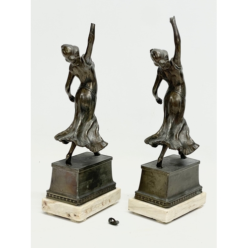 47 - A pair of 1920’s Art Deco spelter and marble figures. 12x8x32cm