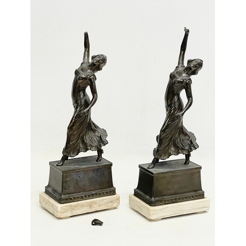 47 - A pair of 1920’s Art Deco spelter and marble figures. 12x8x32cm