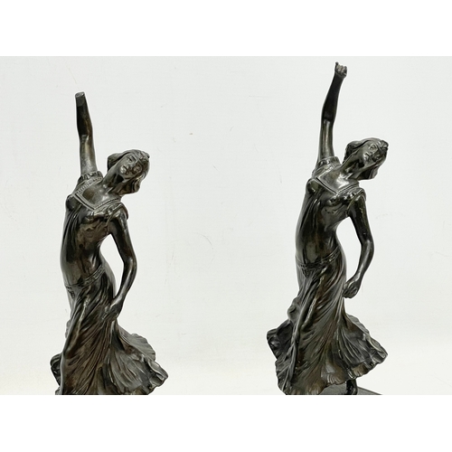 47 - A pair of 1920’s Art Deco spelter and marble figures. 12x8x32cm