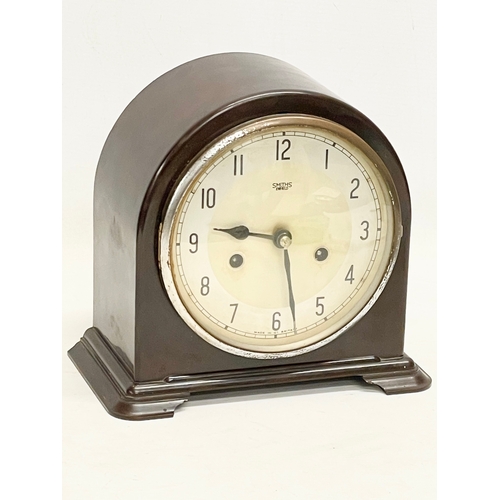 326 - A vintage Art Deco Bakelite mantle clock by Smiths Enfield. With key and pendulum. 22x12x20cm