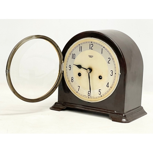 326 - A vintage Art Deco Bakelite mantle clock by Smiths Enfield. With key and pendulum. 22x12x20cm