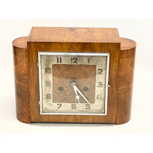 327 - A good quality vintage Art Deco Burr Walnut mantle clock. With key and pendulum. 32x12x23.5cm