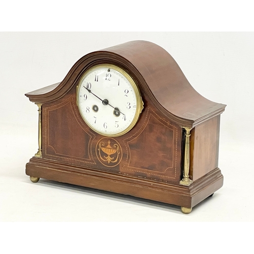 329 - An Edwardian inlaid mahogany mantle clock. With key and pendulum. 30x12x23cm