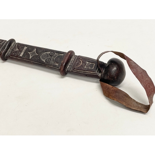 331 - A West African leather bound tribal sword. 66cm