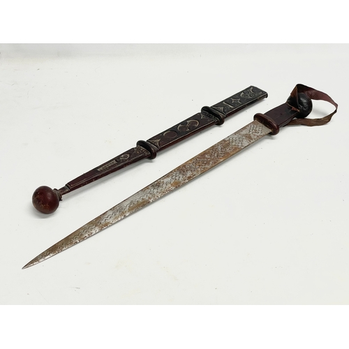 331 - A West African leather bound tribal sword. 66cm