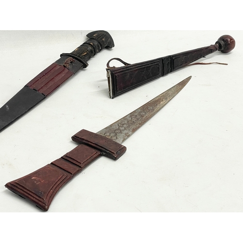 332 - 2 West African leather bound tribal knives. 41cm