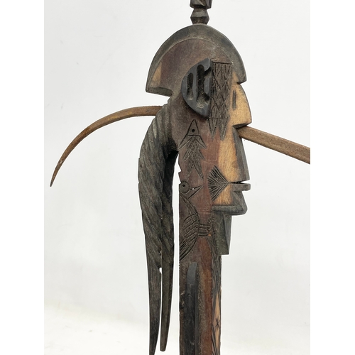 333 - A West African ceremonial tribal axe. 54cm