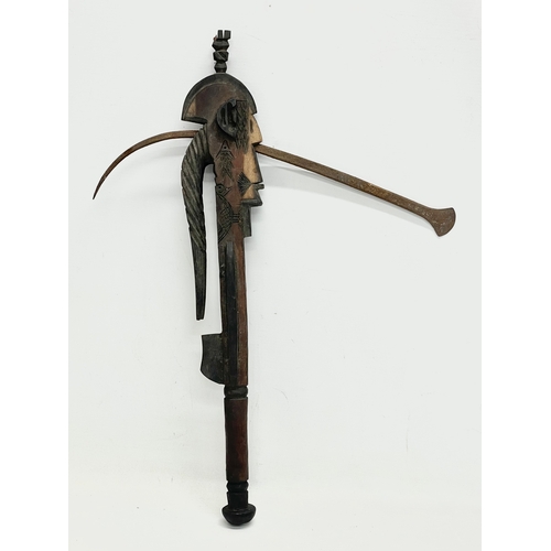 333 - A West African ceremonial tribal axe. 54cm