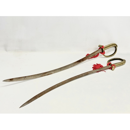 283 - A pair of vintage swords. 88cm