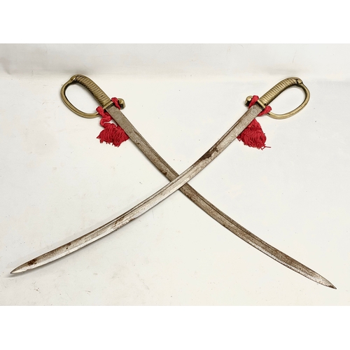 283 - A pair of vintage swords. 88cm