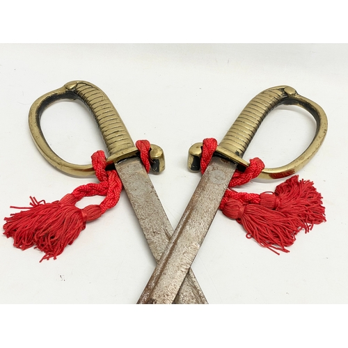 283 - A pair of vintage swords. 88cm