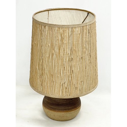 334 - A 1960’s Mid Century stoneware table lamp with original shade. Base measures 17x18cm. Shade measures... 