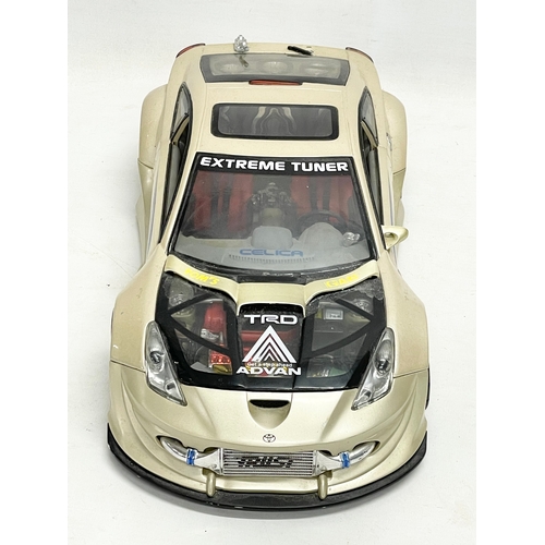 213 - A large 2004 Kentoys Toyota Celica TRD racing car. 37cm