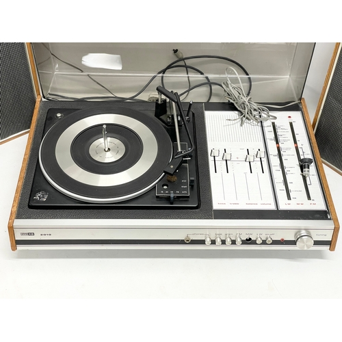 214 - A vintage ITT KB 2010 record player with speakers. 63x41x21cm. Speakers measure 29x18x46cm