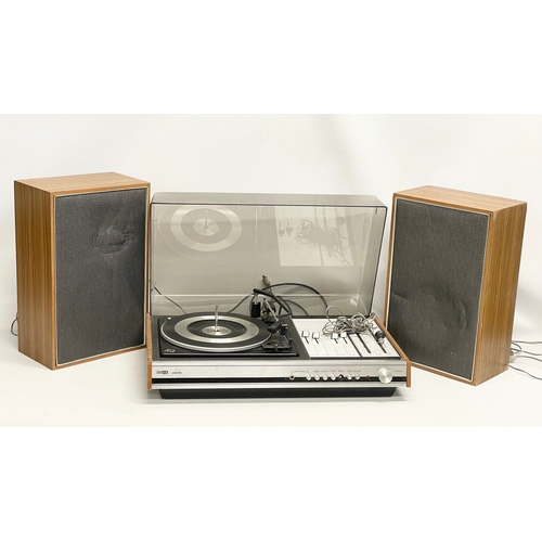 214 - A vintage ITT KB 2010 record player with speakers. 63x41x21cm. Speakers measure 29x18x46cm