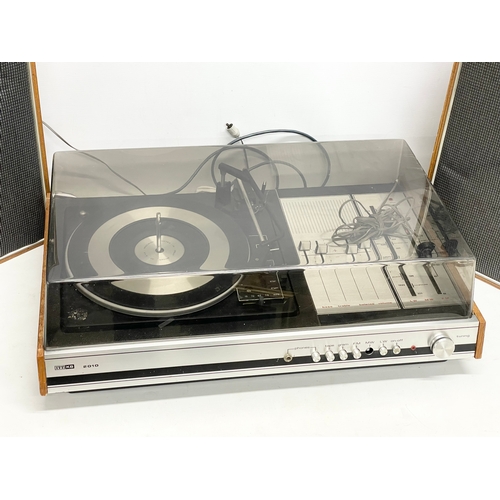 214 - A vintage ITT KB 2010 record player with speakers. 63x41x21cm. Speakers measure 29x18x46cm