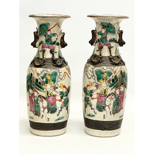 52 - A pair of 19th century Chinese Nanjing pottery vases. 30cm