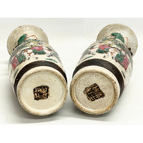 52 - A pair of 19th century Chinese Nanjing pottery vases. 30cm