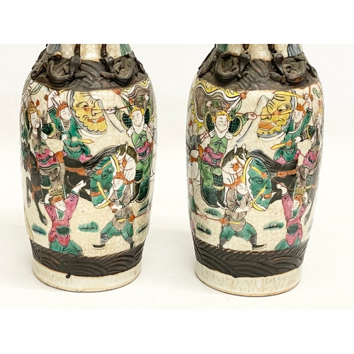 52 - A pair of 19th century Chinese Nanjing pottery vases. 30cm