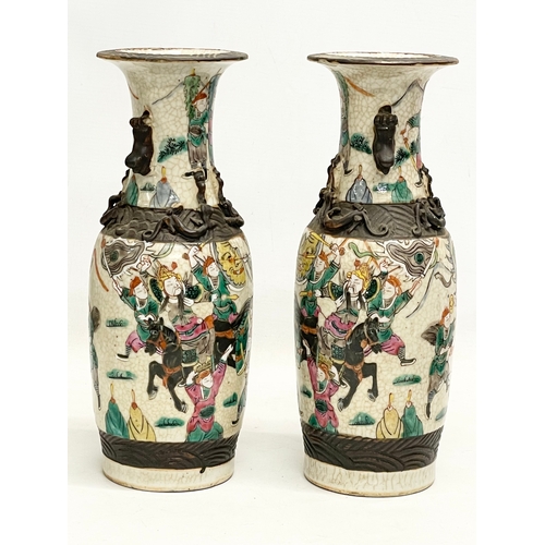 52 - A pair of 19th century Chinese Nanjing pottery vases. 30cm