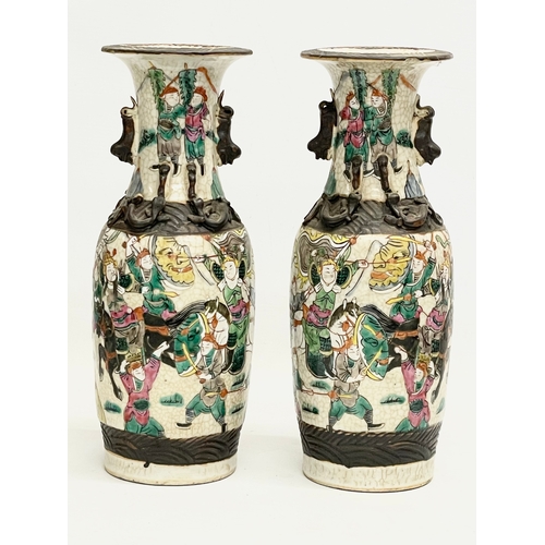 52 - A pair of 19th century Chinese Nanjing pottery vases. 30cm