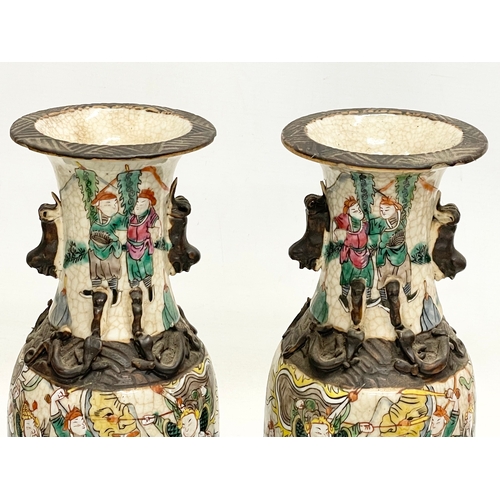 52 - A pair of 19th century Chinese Nanjing pottery vases. 30cm