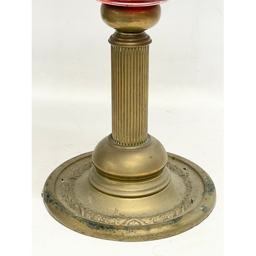 94 - A late Victorian brass double burner oil lamp, with later shade. 1900. 53cm